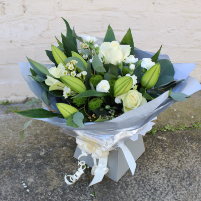 Evelyn - A fabulous collection of white and cream flowers make this the perfect gift. This bouquet will be hand delivered by the local florist.