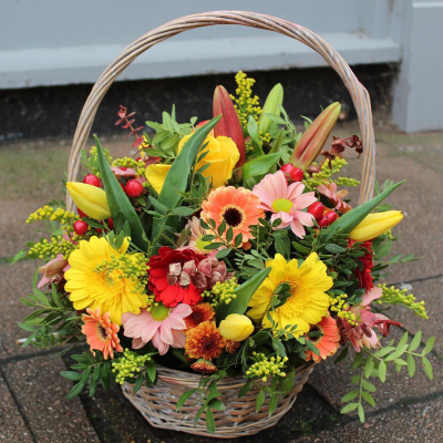 Autumn Hedgerow Basket - A collection of seasonal flowers and foliage arranged in a natural basket.