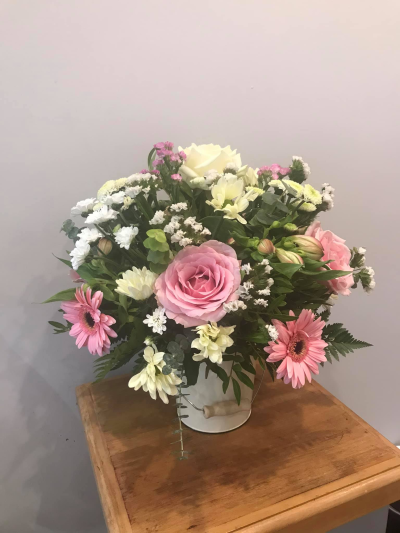 Pot of Happiness - A small but choice selection of flowers arranged in a petite container.