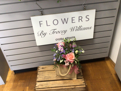 A Little Something - Show your affection with this mouth-watering mix of classical flowers delivered in a delightful gift bag or box.