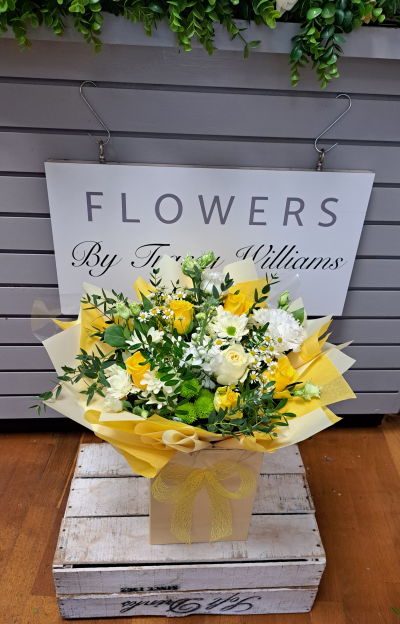 Sunrise - Energise their day with a stunning surprise. A warm collection of seasonal flowers artistically arranged by an artistic florist.